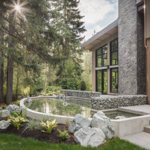 Whistler Backyard pond and lush planting designed by Terracraft
