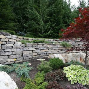 Whistler yard with large stone retaining wall