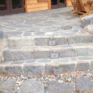 Squamish patio with paving stone steps and retaining wall