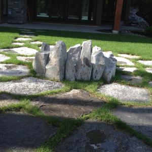 Squamish stone outdoor fireplace and patio by Terracraft