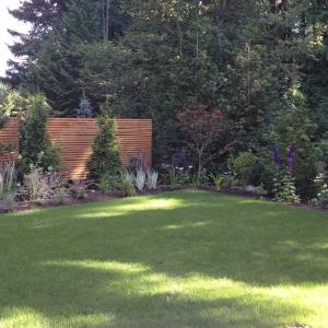 Squamish cedar garden screen creating a private outdoor seating area