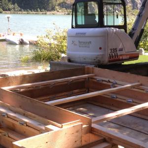 Whistler lakeside property with concrete forms set along the shoreline