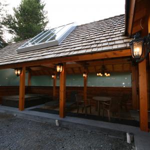 Whistler cedar privacy screen and deck carpentry beside a hot tub
