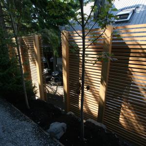 Pemberton side yard cedar privacy screen running along the property line