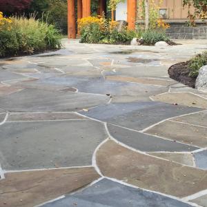 Colourful paving stone surface with mixed tones and a detailed laying pattern
