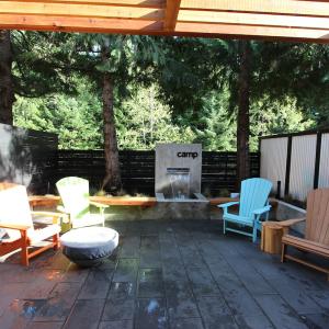 Outdoor camp-style stone patio and firepit gathering area