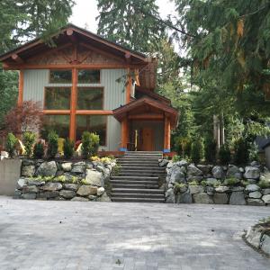 Whistler front entrance with stone steps and custom planting design